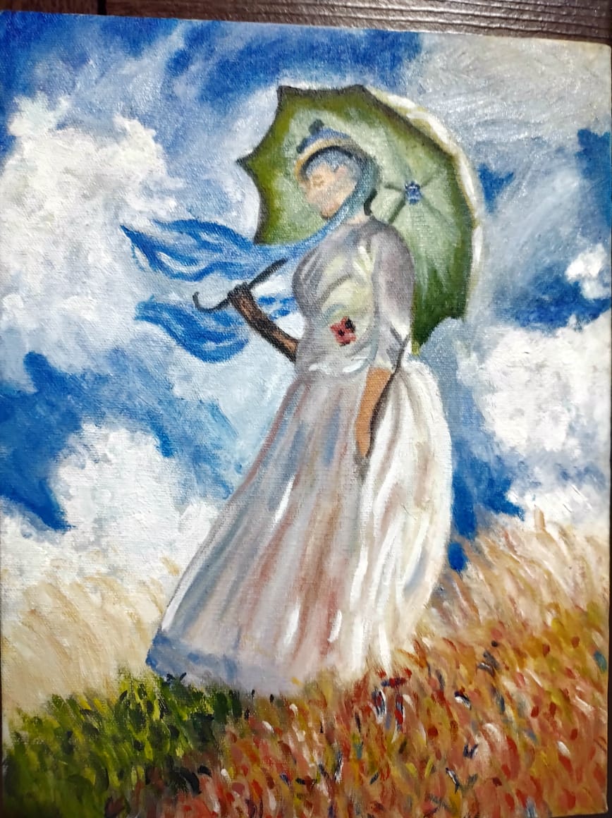 Aluna com sua pintura concluída